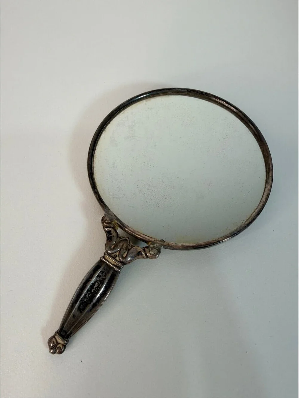Vintage antique silver tone hand mirror with engraved sunburst back